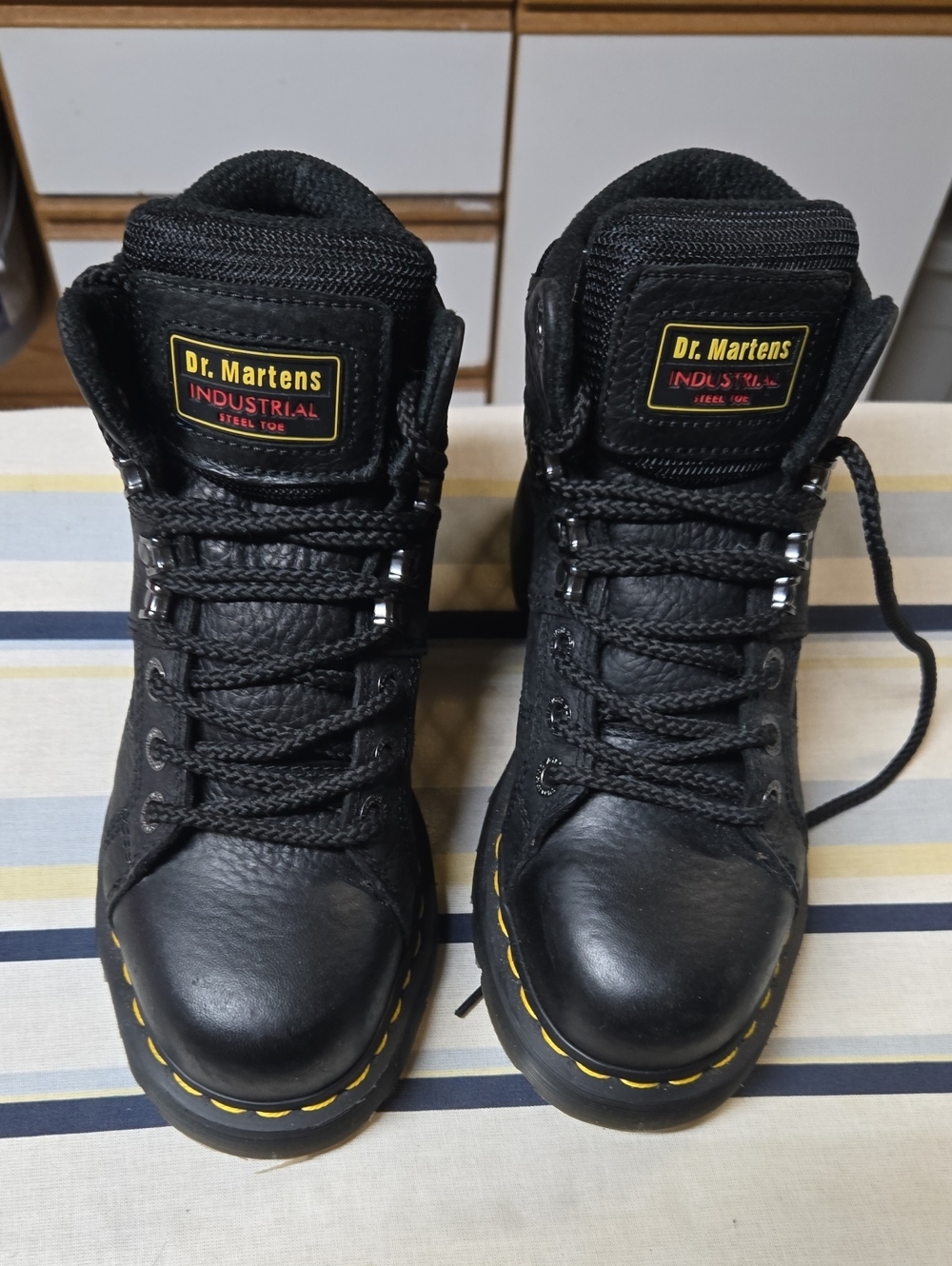 Dr. Martens Black Industrial Steel-Toe Work Boots with Yellow Welt Stitching